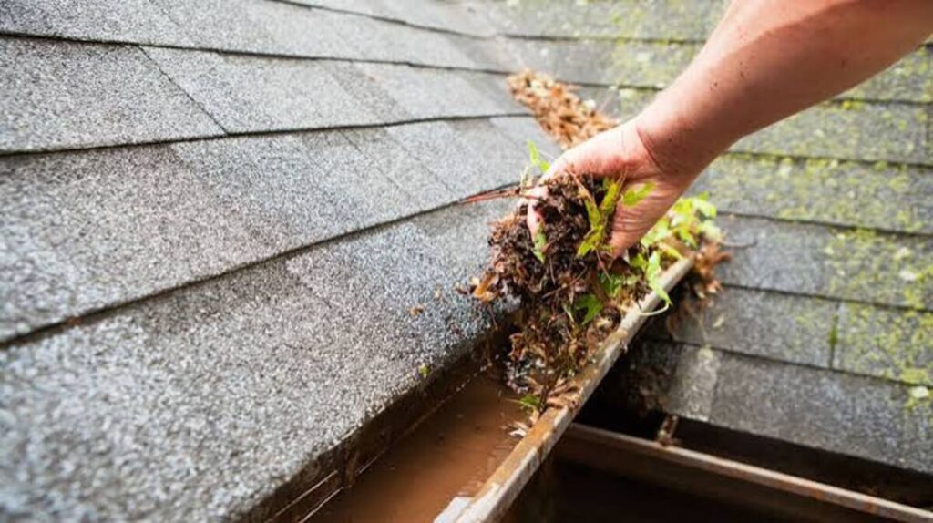 Summit Spray. Co completing a professional gutter cleaning.