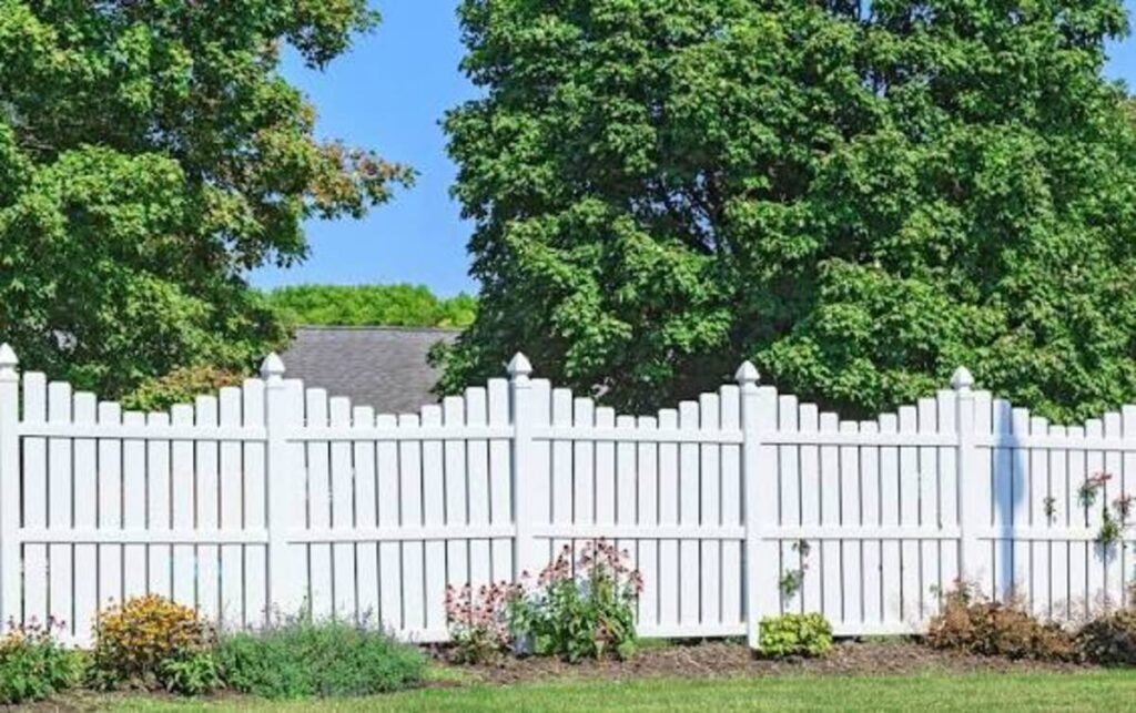 This image shows a fence cleaned by Summit Spray.co